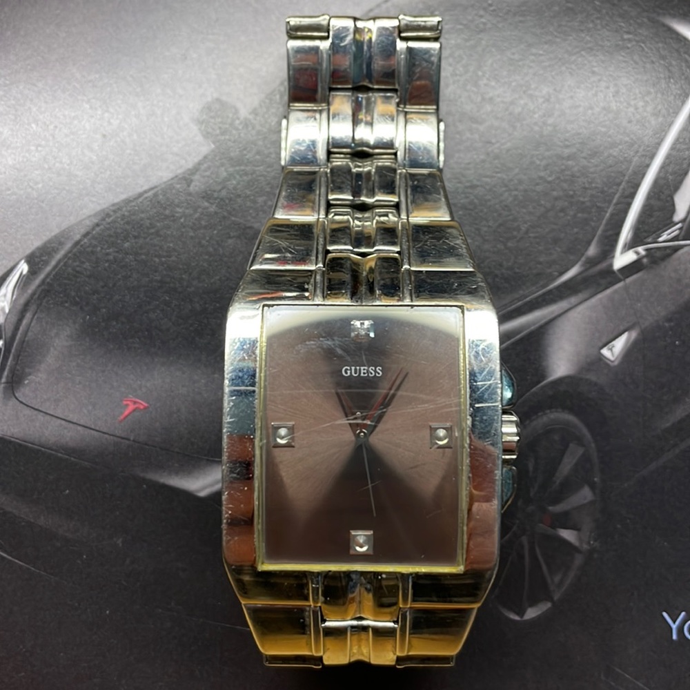 Guess silver watch with taupe face.
